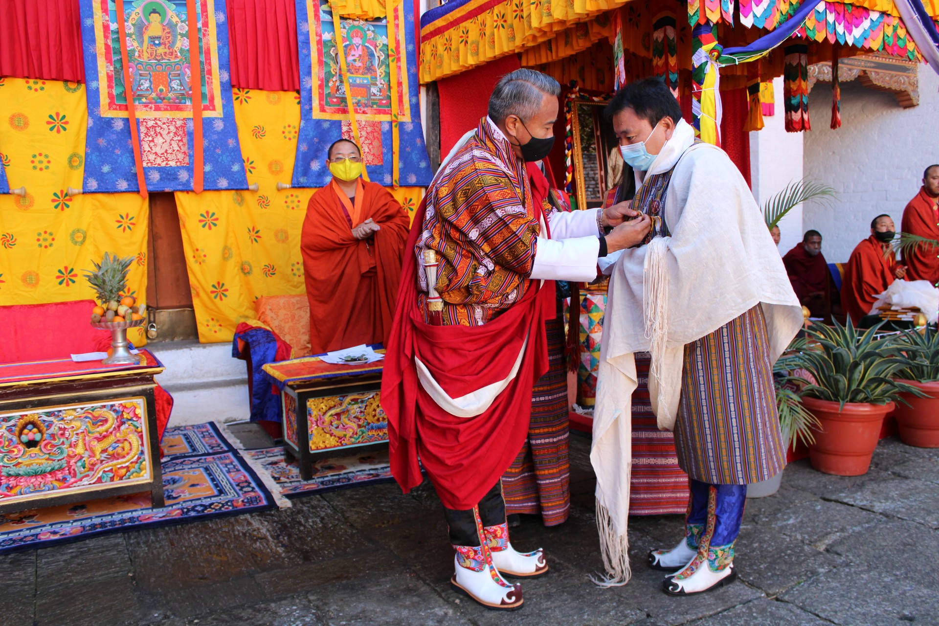 Dzongkhag Health Officer receiving a Thuksey medal from Dasho Dzongdag which was conferred by His Majesty The Fifth King on 113th National Day to all the Health officials