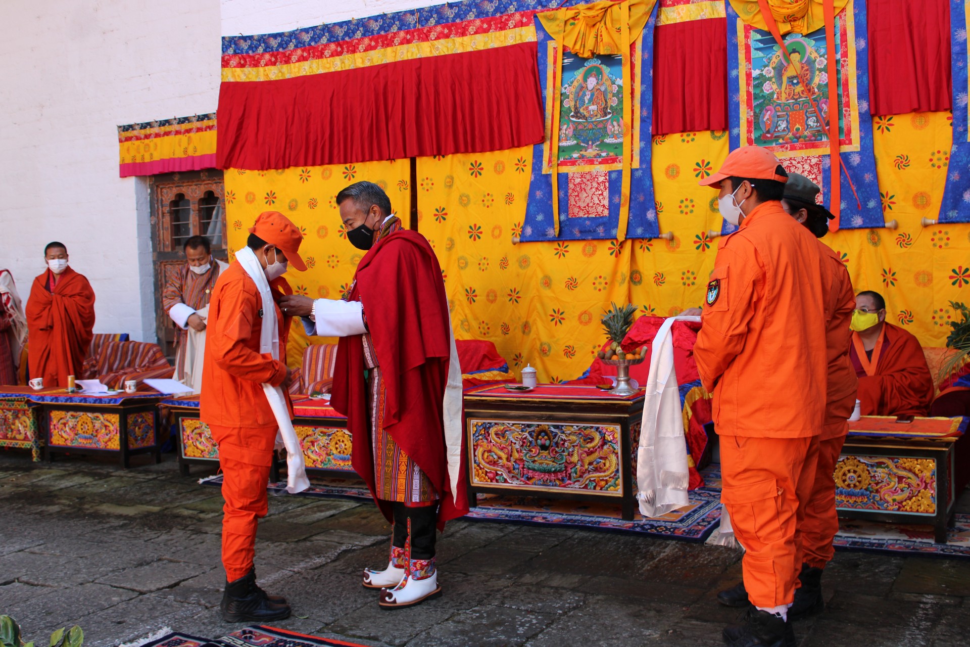 One of the Desuups receiving a pin from Dasho Dzongdag